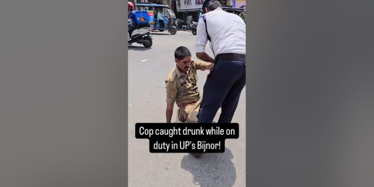 Drunk Constable Stumbles on Busy Bijnor Road, Sparks Public Outrage and Demands for Accountability Bijnor, Uttar Pradesh — April 19, 2025