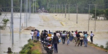 At least 34 people have died in India's northeast following devastating floods caused by heavy rains, with thousands displaced and rescue operations ongoing.